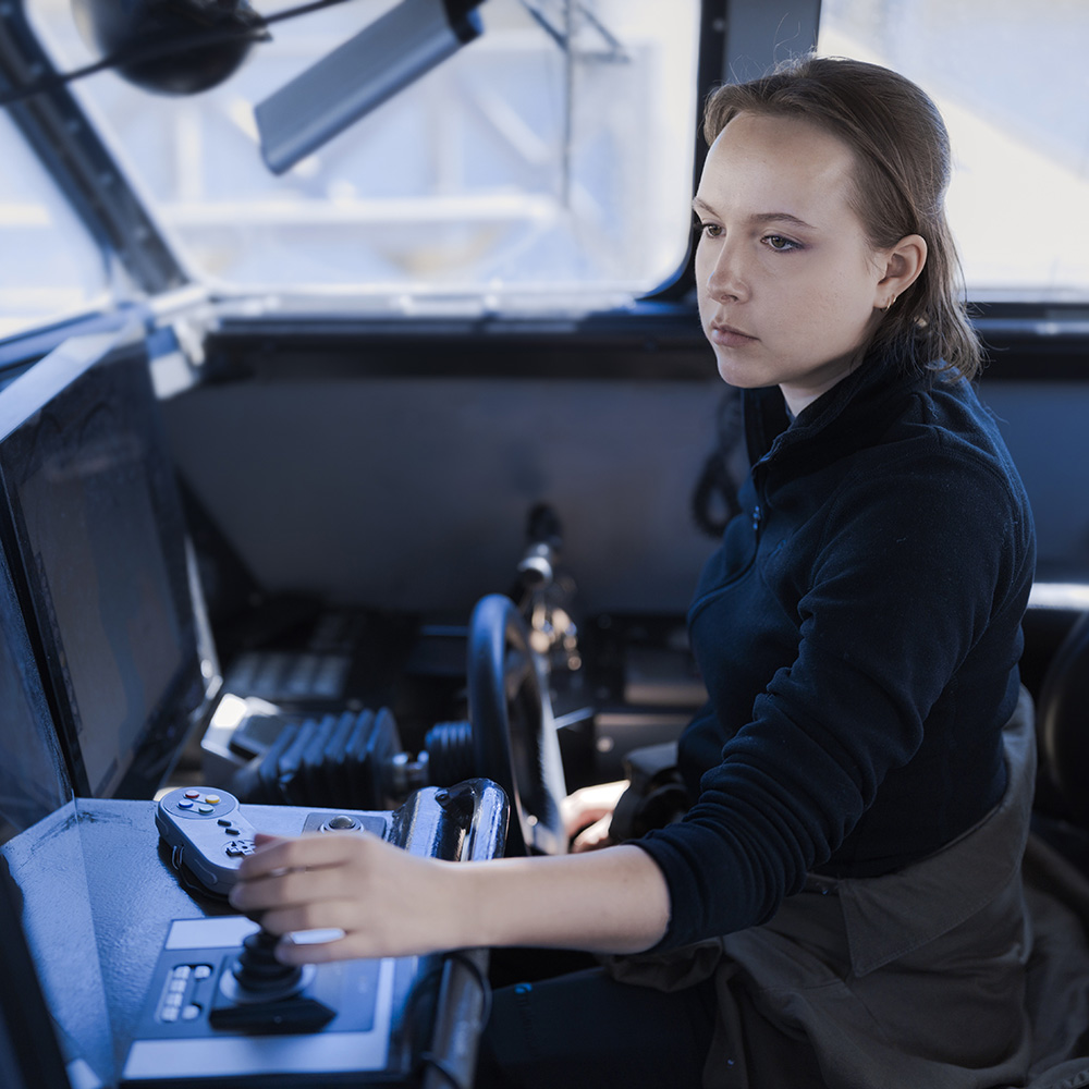 Female engineer working on a ship